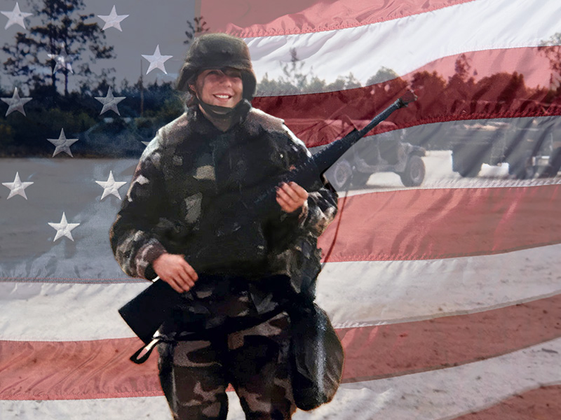 Carrue Hogue, veteran and owned of Free Air Life, smiling on training ground, overlaid with translucent American flag